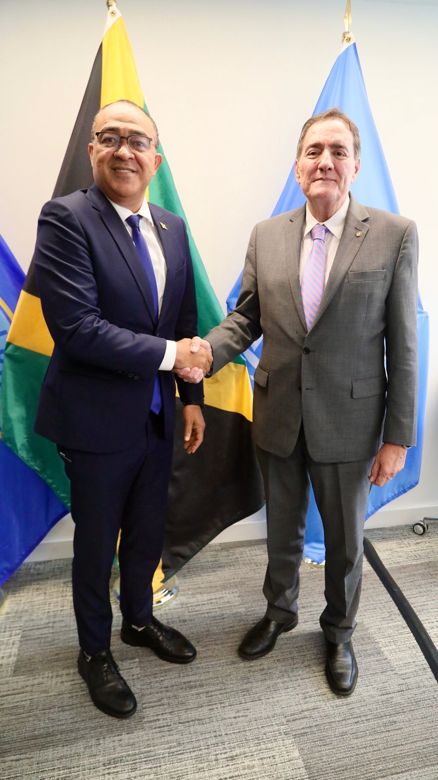 Jamaica's Minister of Health & Wellness, Dr. the Hon. Christopher Tufton (left) greets Dr. Jarbas Barbosa Da Silva Jr, Director of the Pan-American Health Organisation (PAHO) at the 61st PAHO Directing Council Meeting now ongoing in Washington DC. Jamaica commends PAHO on Sepsis Strategy