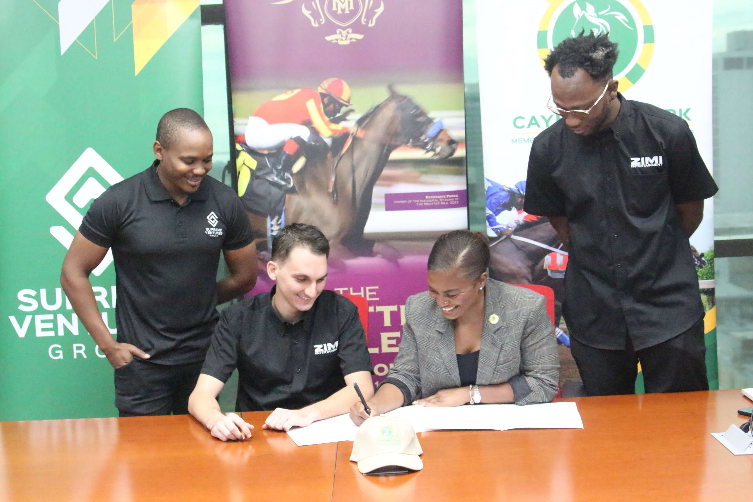 from left to right: Supreme Ventures Limited (SVL) Head of Marketing, Kamal Powell, Zimi Entertainment CEO, Nicholas Mahfood, Supreme Ventures Racing and Entertainment Limited (SVREL) Brand Optimization Manager, Arielle Beckles and Zimi Entertainment Sponsorship and Events Manager, Pierre Beckford during the official Mouttet Mile partnership signing at SVL Corporate offices recently. Zimi Seh Mouttet Mile: Popular Party Series Joins Forces with Supreme Ventures
