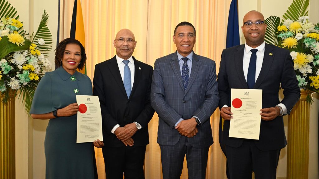 Governor General Sir Patrick Allen (2nd right) and Prime Minister Andrew Holness (centre) share a photo with newly appointed ministers Audrey Marks (left) and Delano Seiveright (left) at King's House on Monday, March 17, 2025. Senators Marks and Seiveright officially sworn as ministers